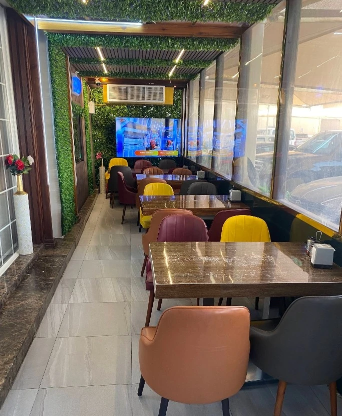 Colorful dining area at Grillo Restaurant Fanateer, Al Jubail.