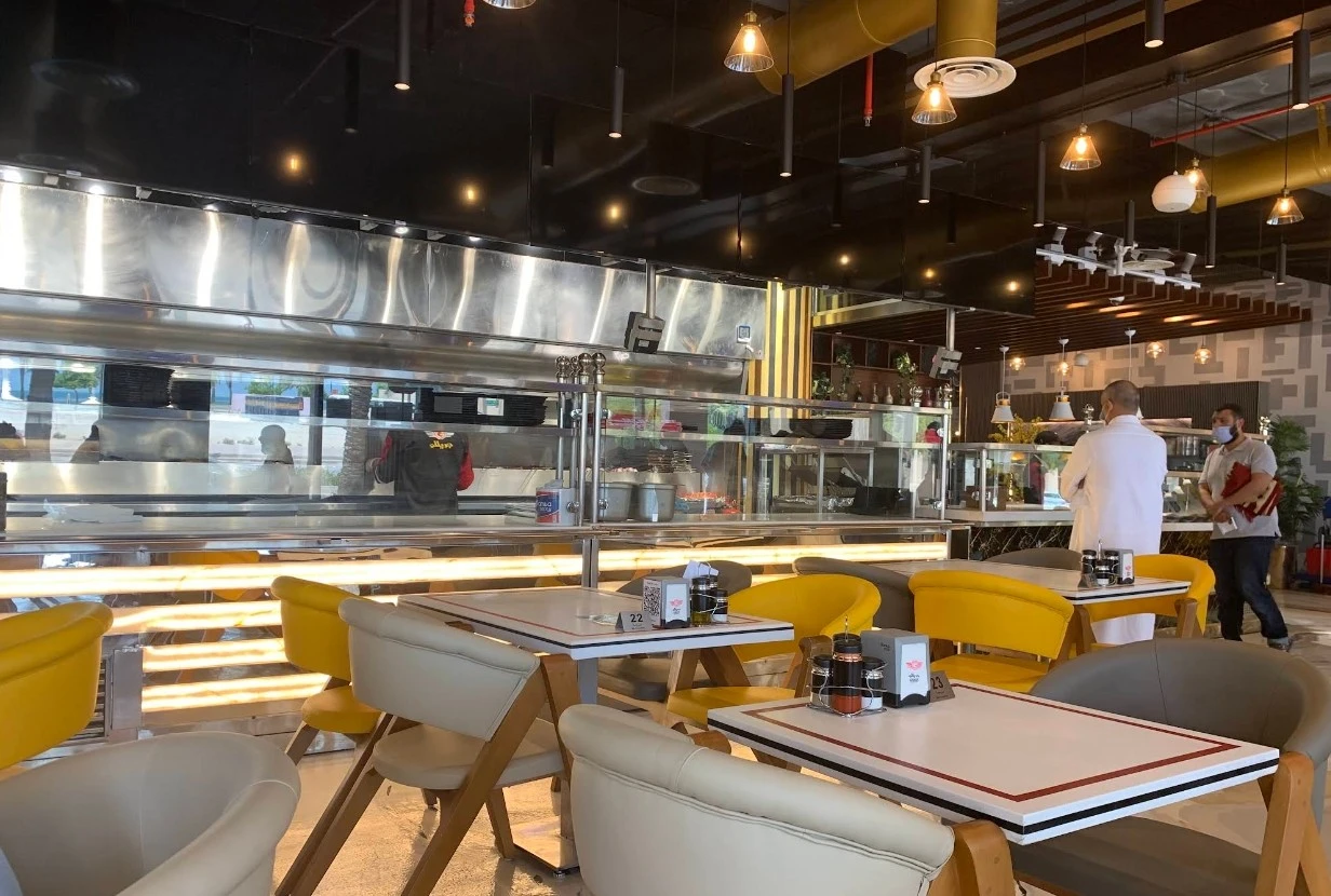Modern interior of Grillo Restaurant Fanateer, Al Jubail with seating area.