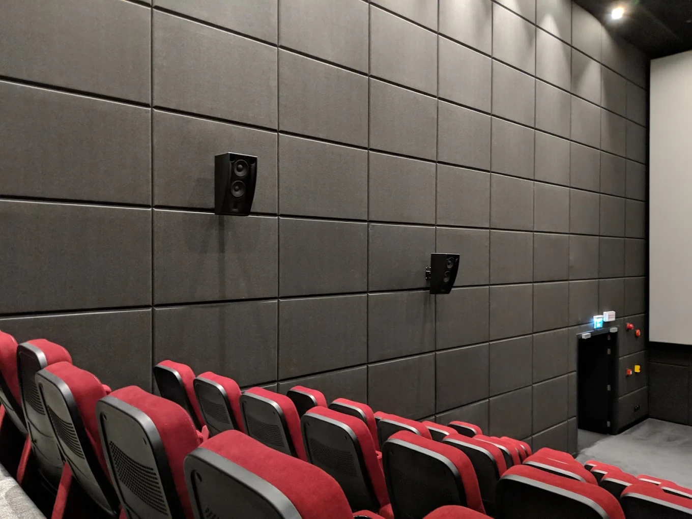 Interior of Flik Cinema, Al Mirqab Mall, Doha with red seats.