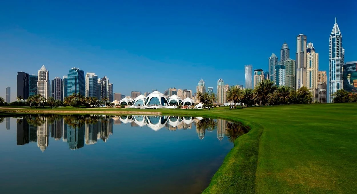 Emirates Golf Club with Dubai skyline reflection in water
