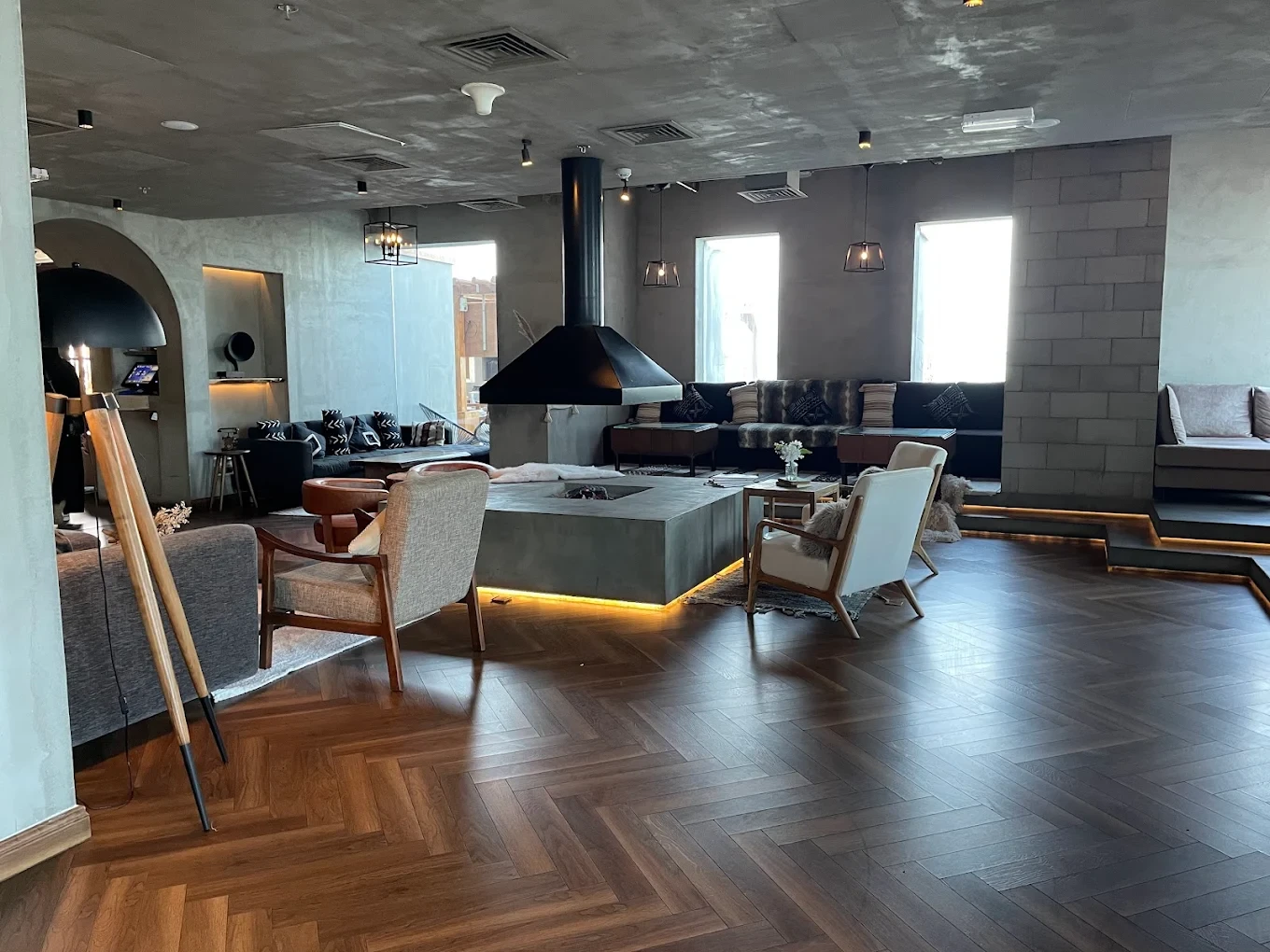 Modern lounge area at The House Restaurant Lusail, featuring cozy seating.