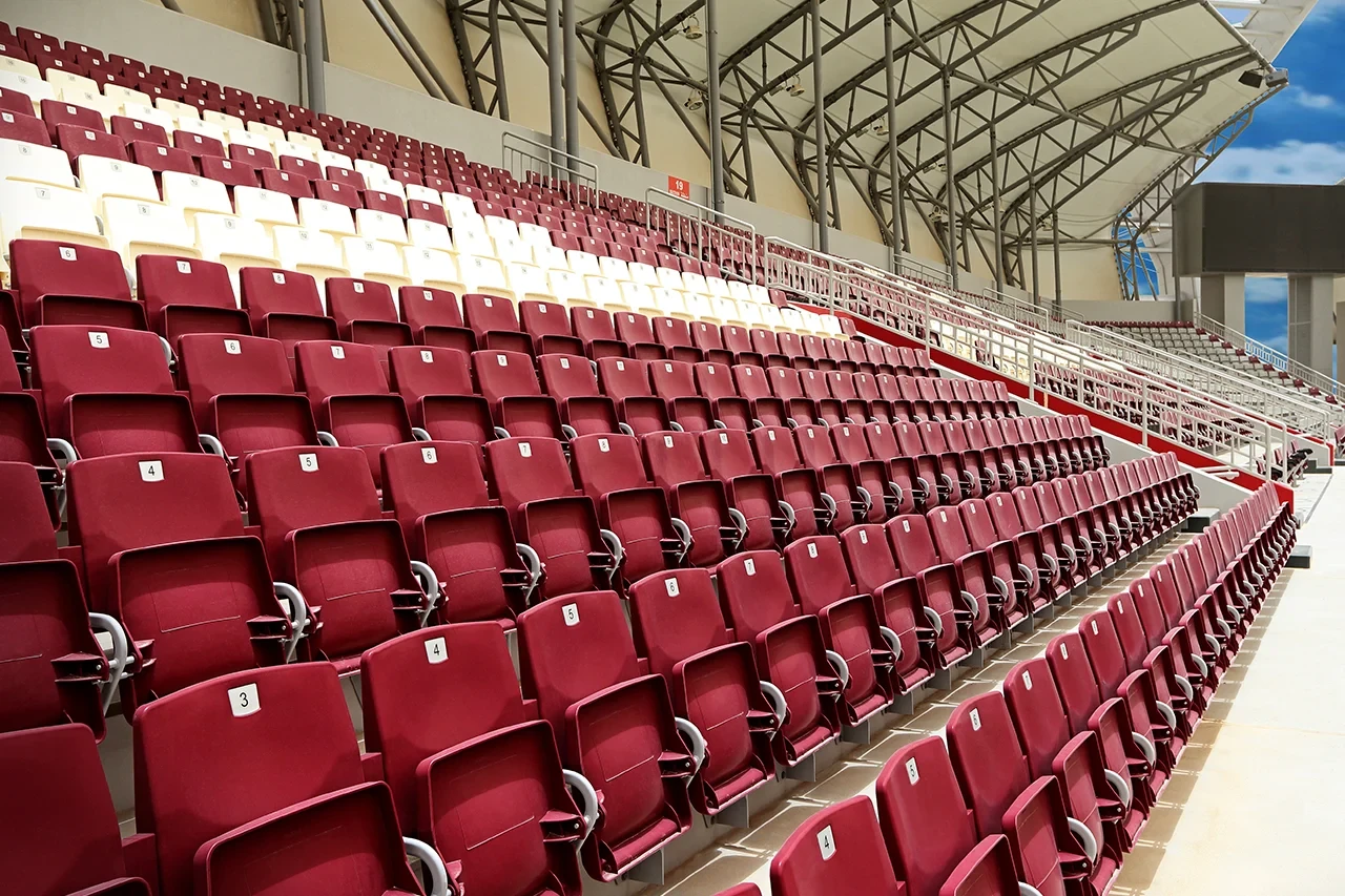 Empty maroon seats at Abdullah Bin Khalifa Stadium, Doha.