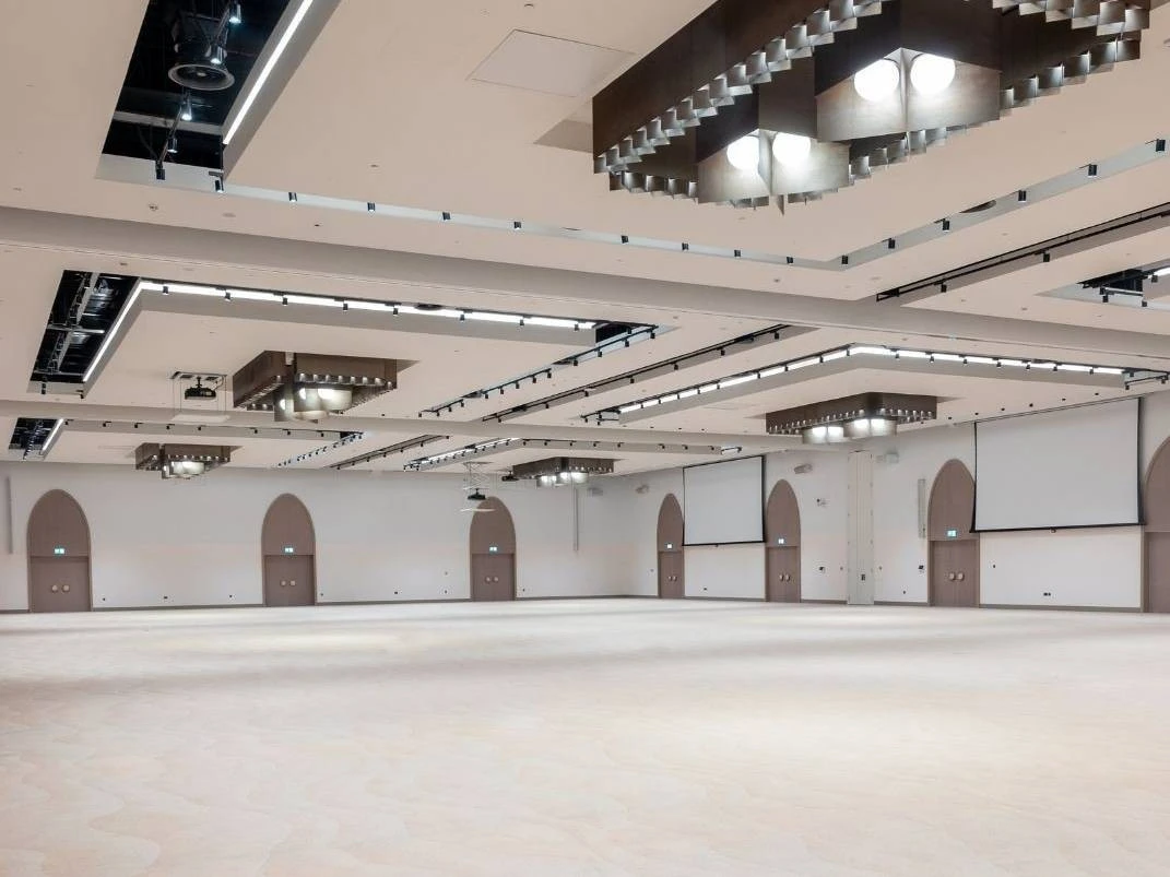 Spacious ballroom at Erth Hotel Abu Dhabi with modern lighting.