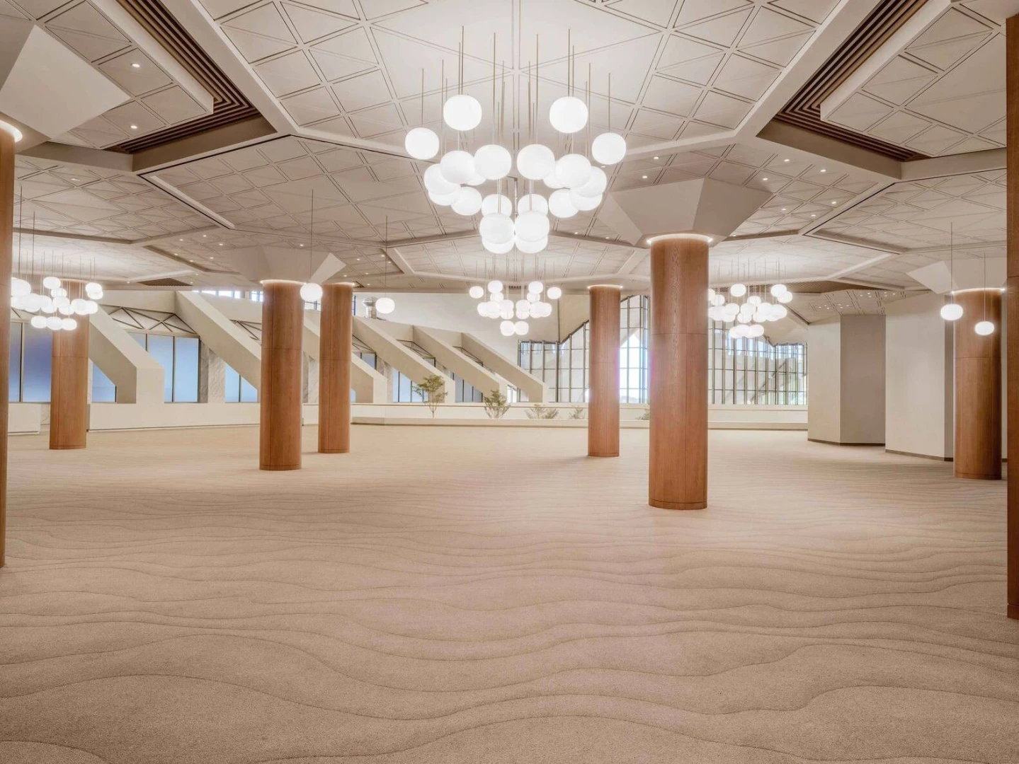 Spacious ballroom with chandeliers at Erth Hotel Abu Dhabi.