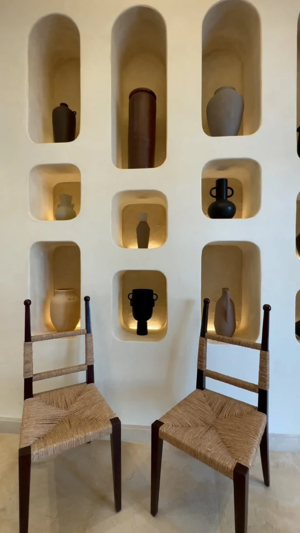 Decorative wall niches and chairs at Yamaz Restaurant, Manama.
