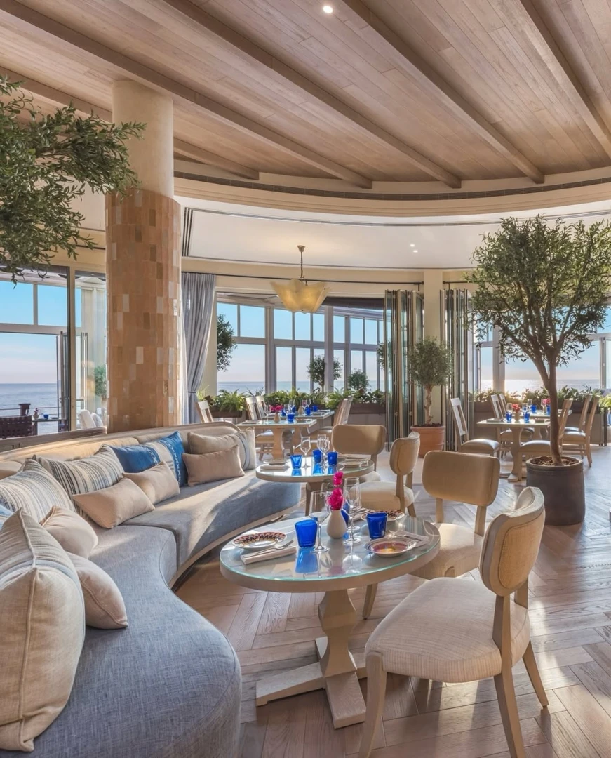 Elegant seating area in Yamaz Restaurant, Manama with sea view.