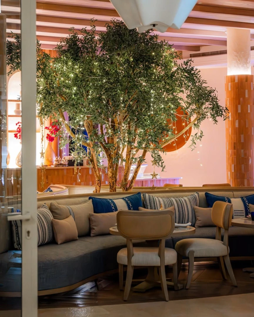 Cozy seating under tree lights at Yamaz Restaurant, Manama.
