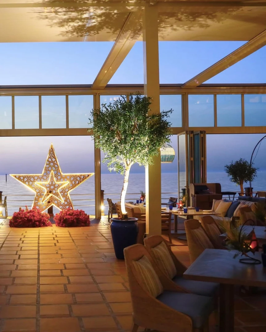Yamaz Restaurant Bahrain terrace with sea view and decorative star.