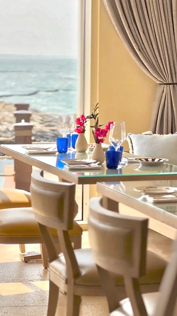 Elegant dining setup at Yamaz Restaurant Bahrain, overlooking the sea in Manama.