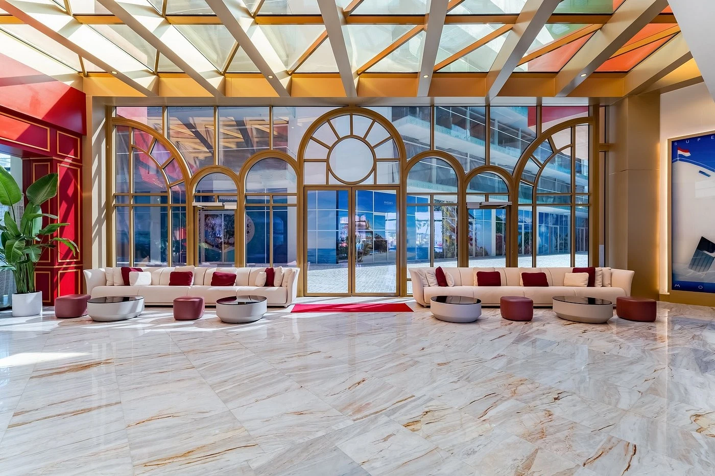 Elegant lobby at Voco Monaco Dubai with modern seating and large windows.