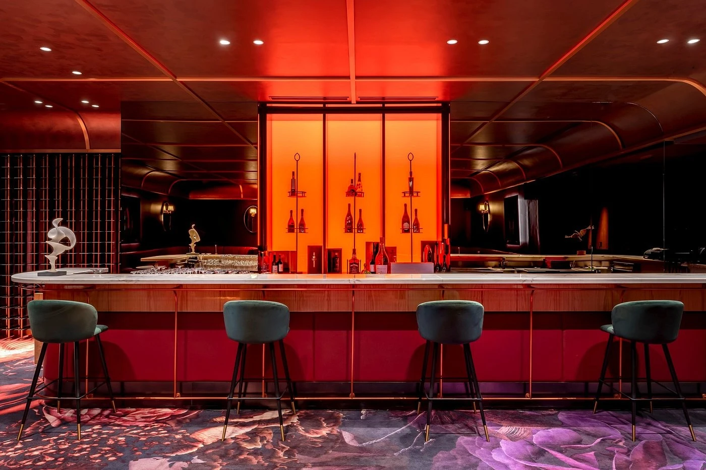 Elegant bar with red lighting at Voco Monaco Dubai by IHG.