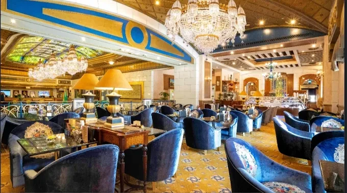 Elegant dining area at Tuheed Pakistani Restaurant, Makkah with chandeliers.