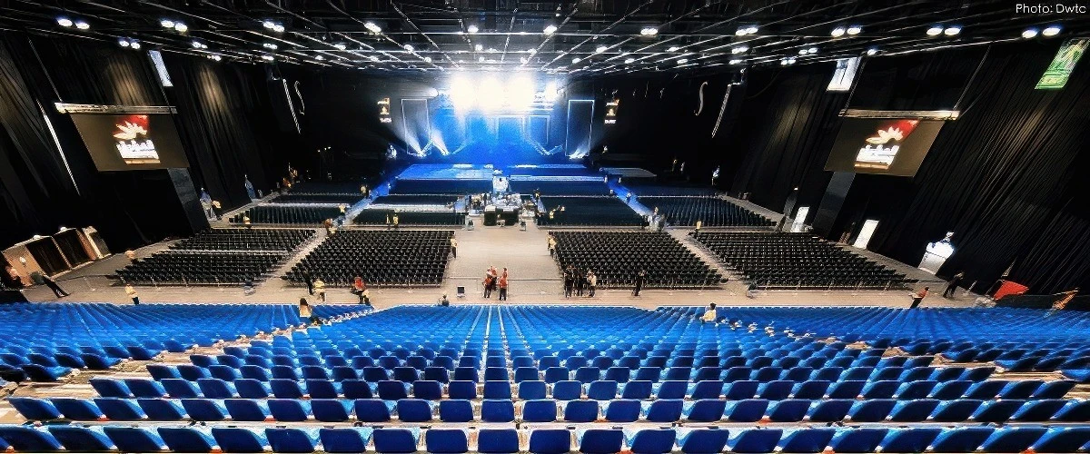 Sheikh Rashid Hall in Dubai with rows of blue seating.