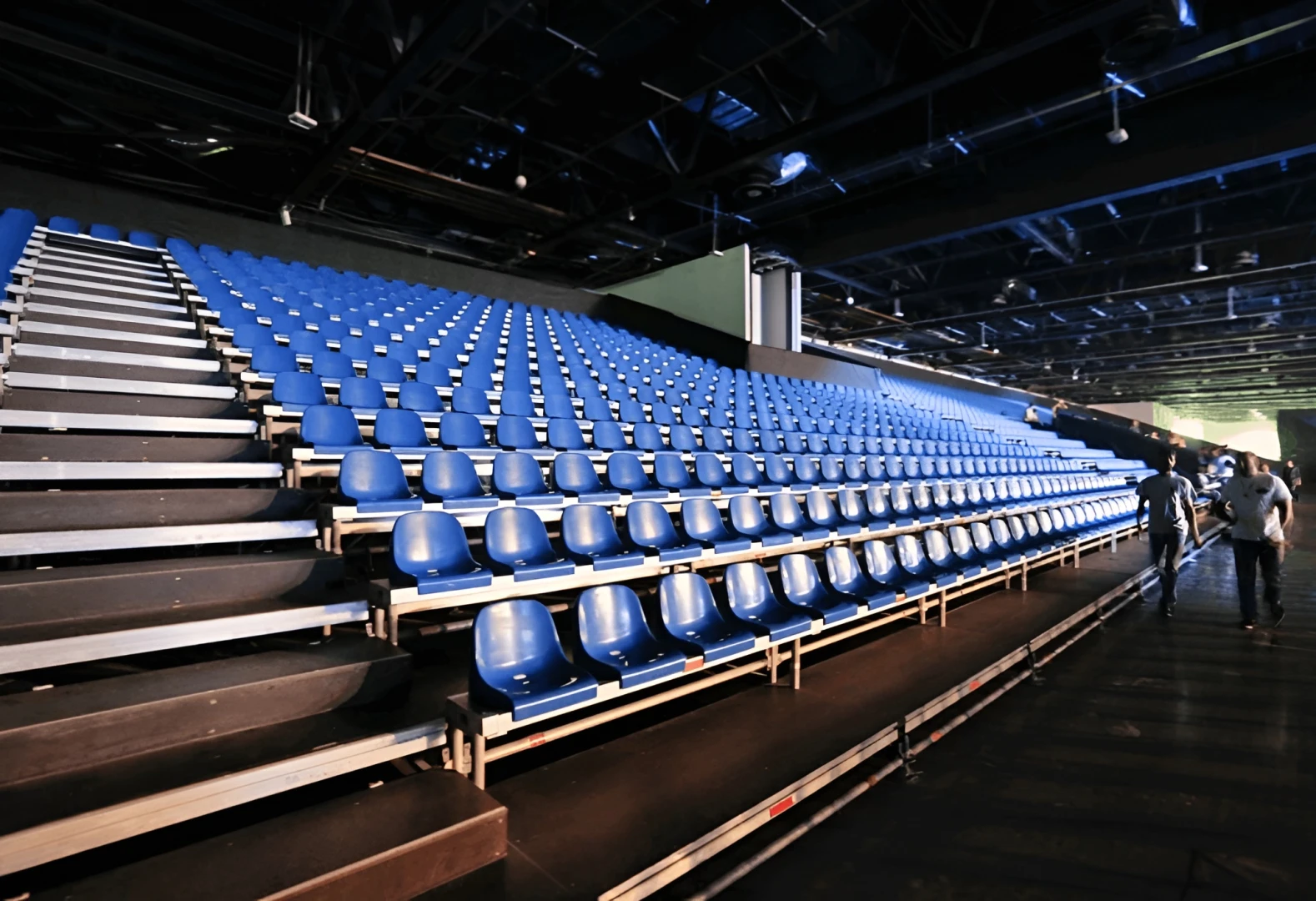 Empty blue seating in Sheikh Rashid Hall, Dubai.