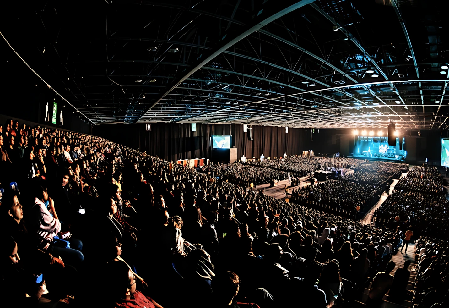 Crowded Sheikh Rashid Hall in Dubai during an event.