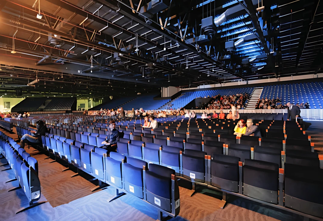 Sheikh Rashid Hall seating area with attendees, Dubai.