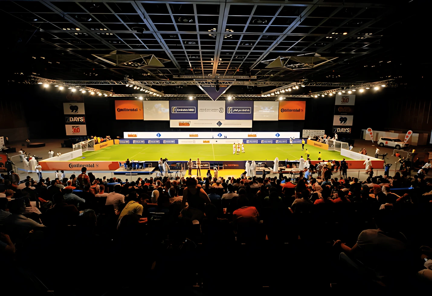 Indoor sports event at Sheikh Rashid Hall, Dubai, with audience.