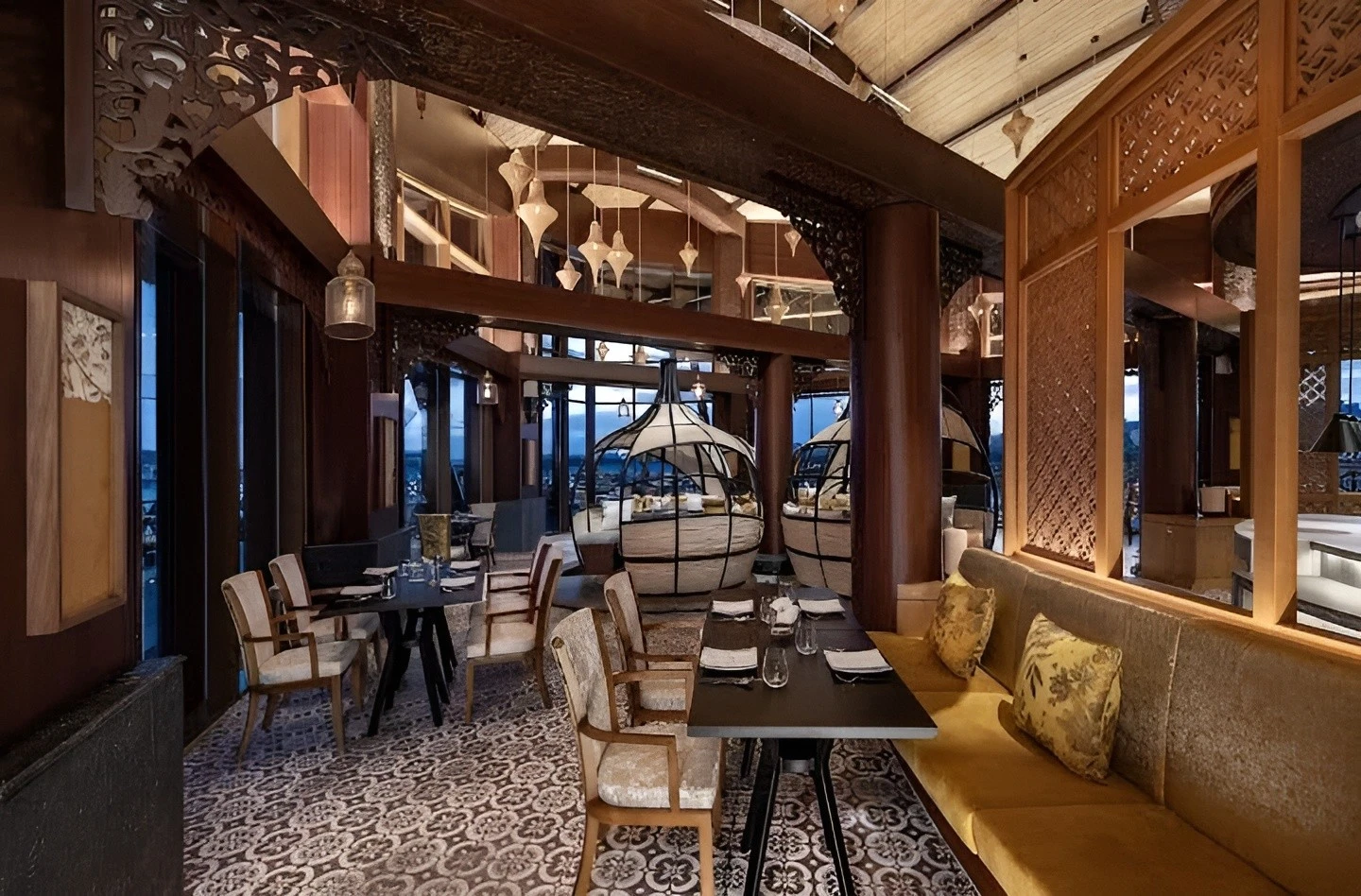 Luxurious dining with intricate woodwork at Mekong Restaurant, Ras Al-Khaimah.