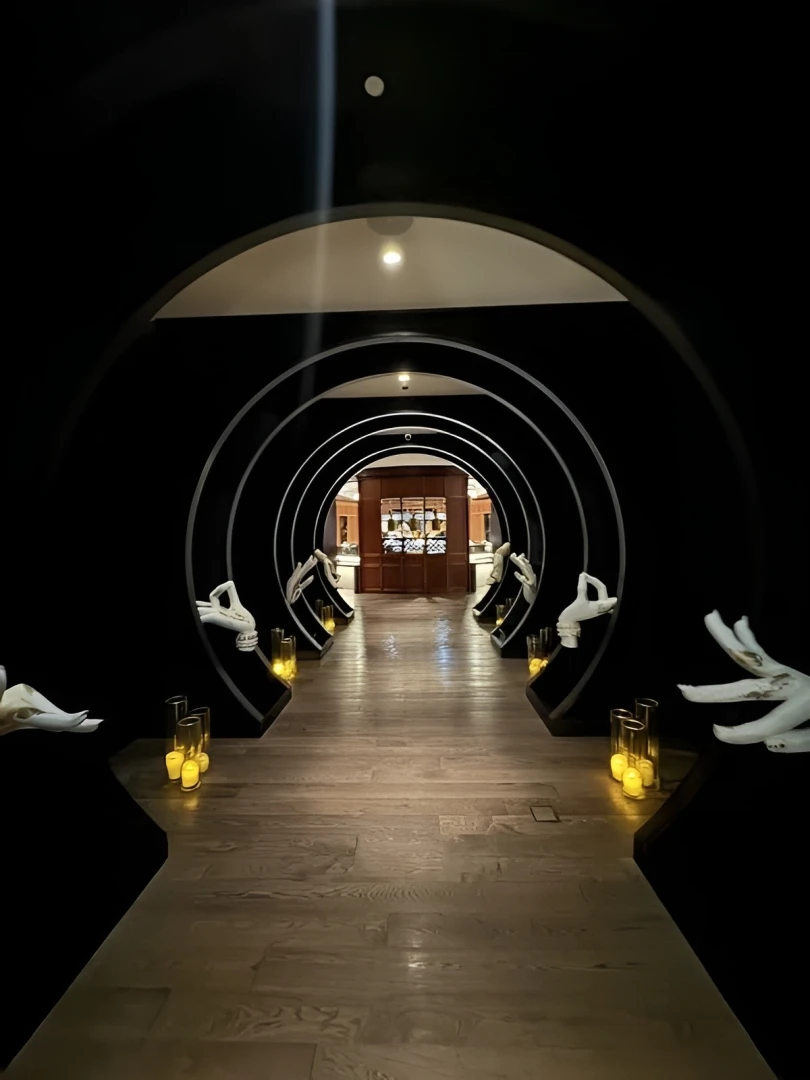 Dimly lit hallway with arches, Mekong At Anantara Mina, Ras Al-Khaimah.