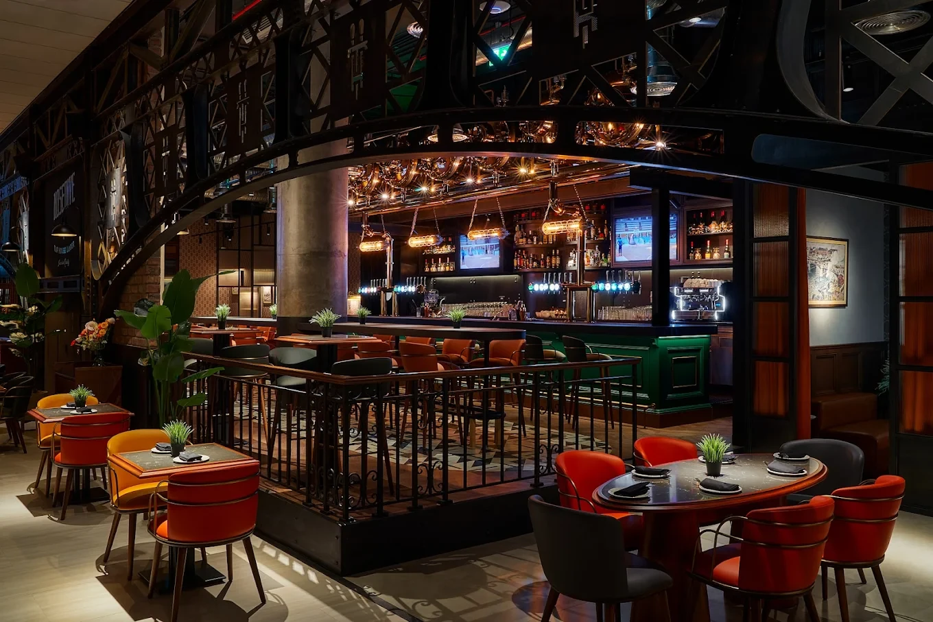 The Tap House Dubai Hills, stylish interior with bar and seating.