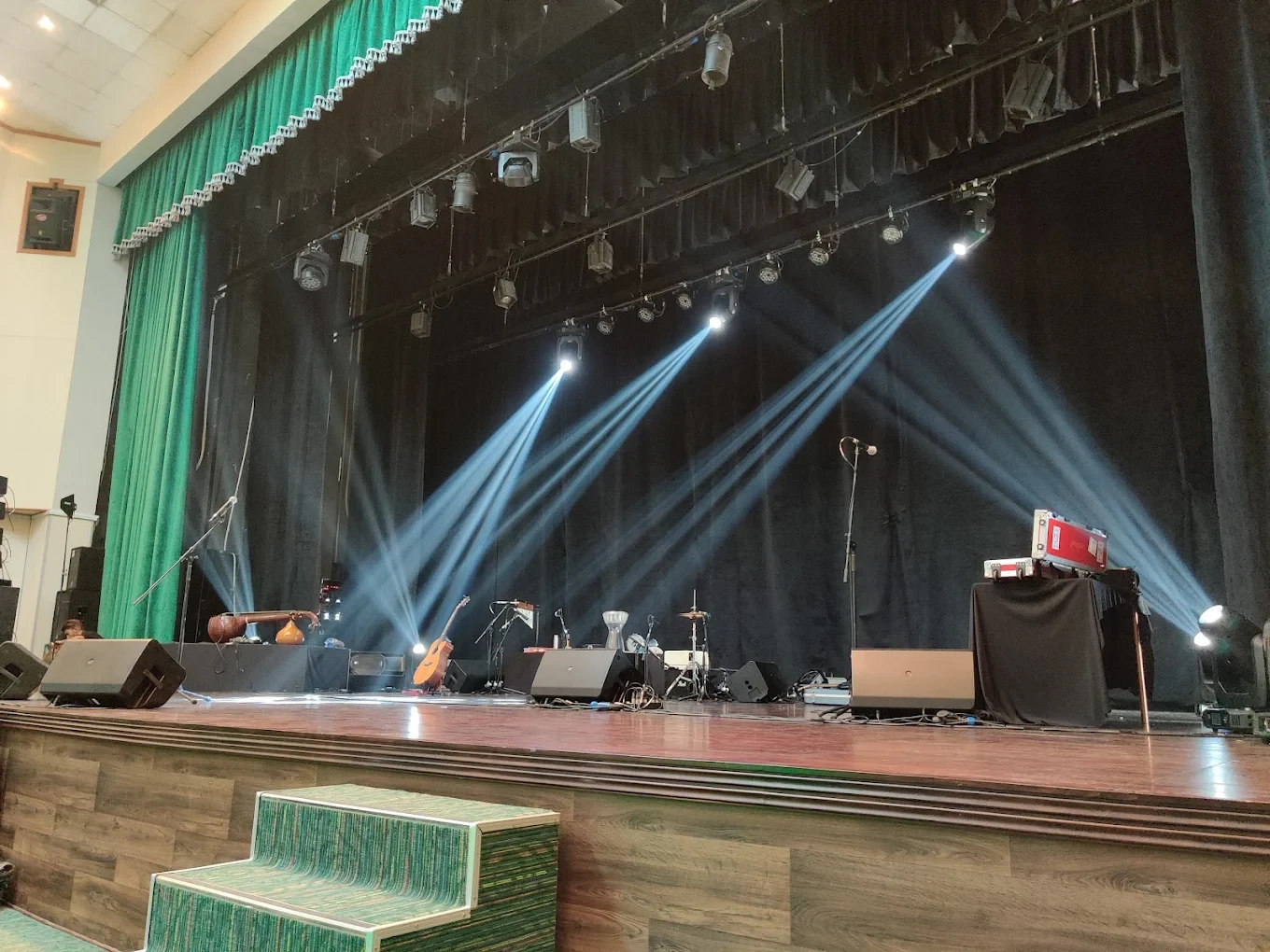 Stage setup at Emirates Theatre, Dubai with instruments and lighting.