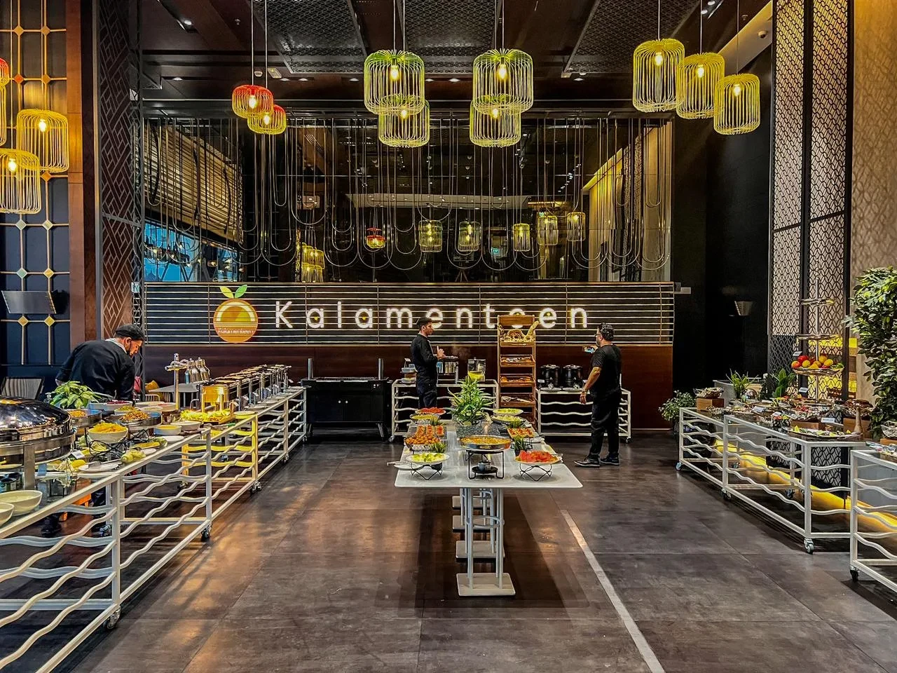 Buffet setup at The Kana Cafe Downtown Dubai with modern decor.