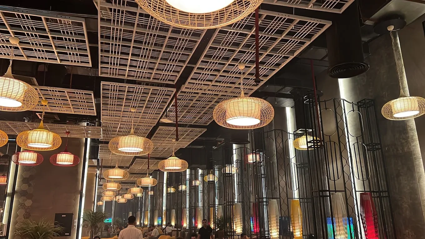 Modern interior with hanging lights at The Kana Cafe, Downtown Dubai.
