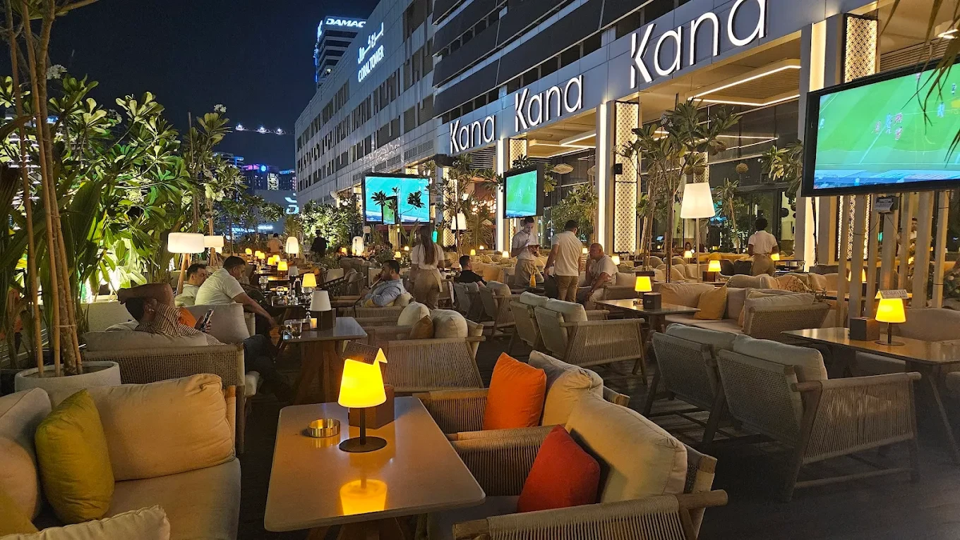 Outdoor seating at The Kana Cafe Downtown Dubai, evening ambiance.