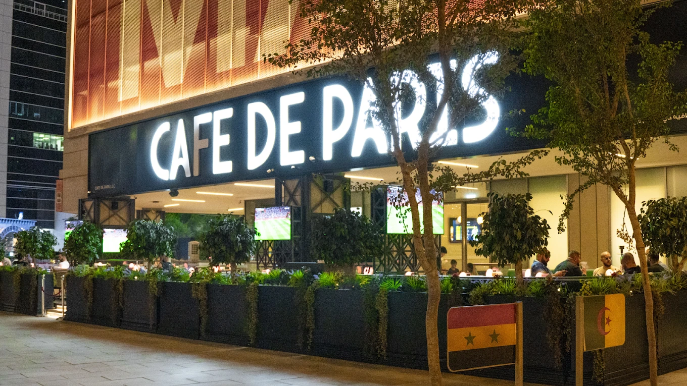 Cafe De Paris entrance with outdoor seating, Downtown Dubai.