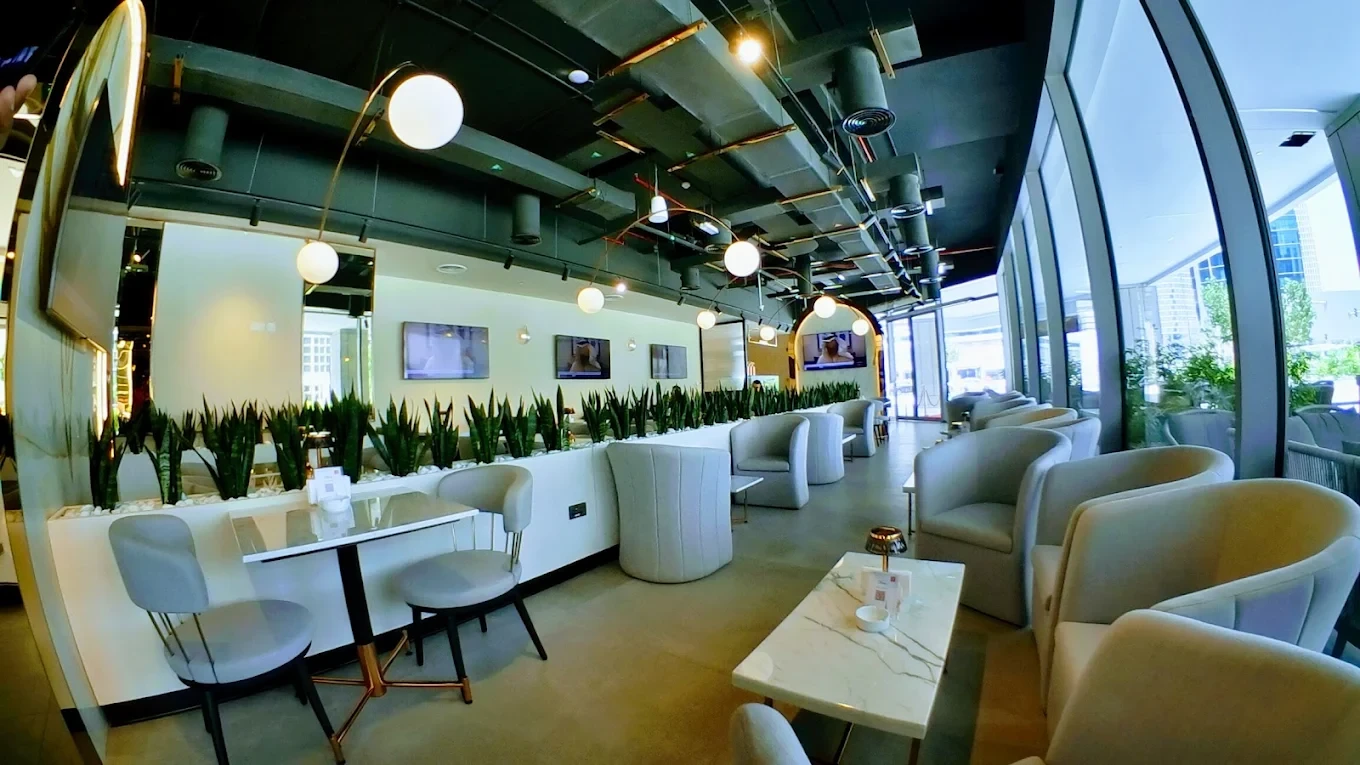 Modern interior of Cafe De Paris, Downtown Dubai, with elegant seating.