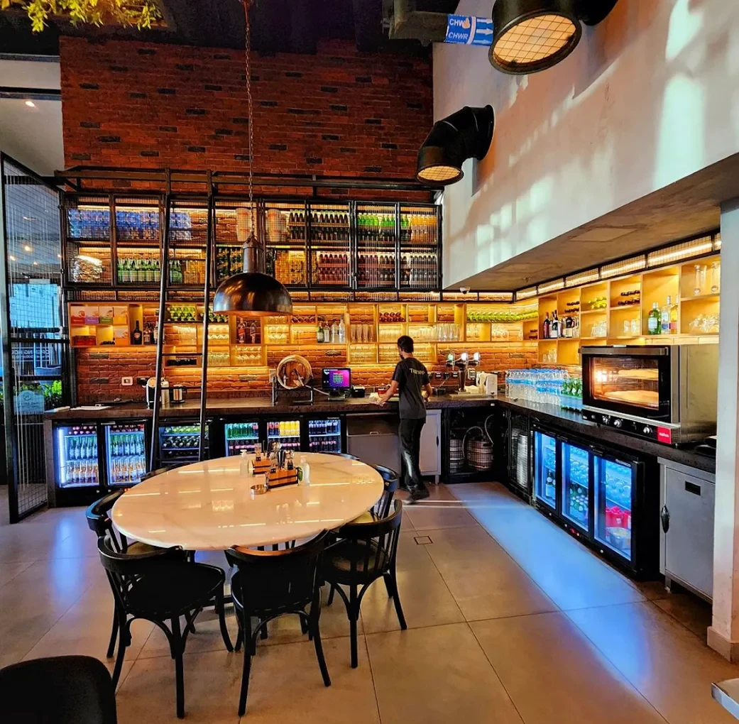 Swiss Butter Steak House interior with bar and dining table, Dubai.