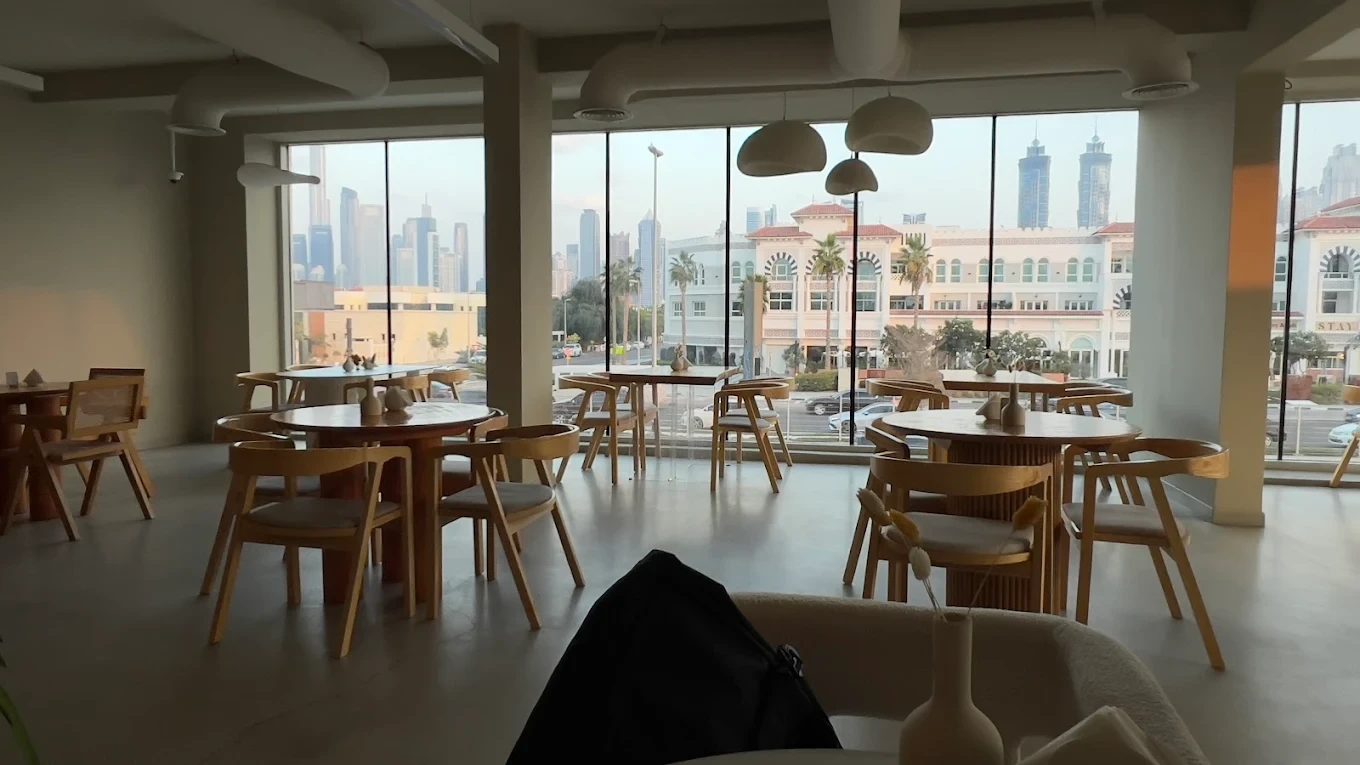 Savva All Day Lounge interior with city view, Dubai.