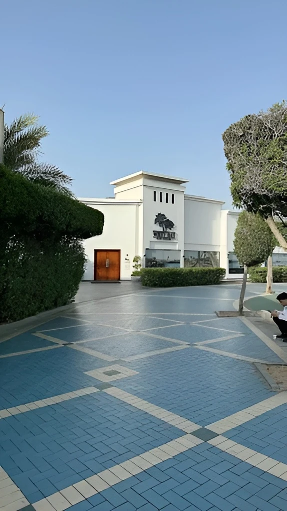 West Bay Lounge entrance with blue tiled path, Abu Dhabi.