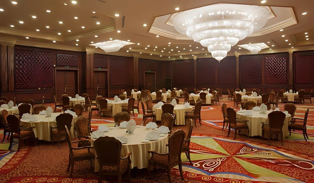 Elegant banquet hall with chandeliers at Regency Hall Doha.
