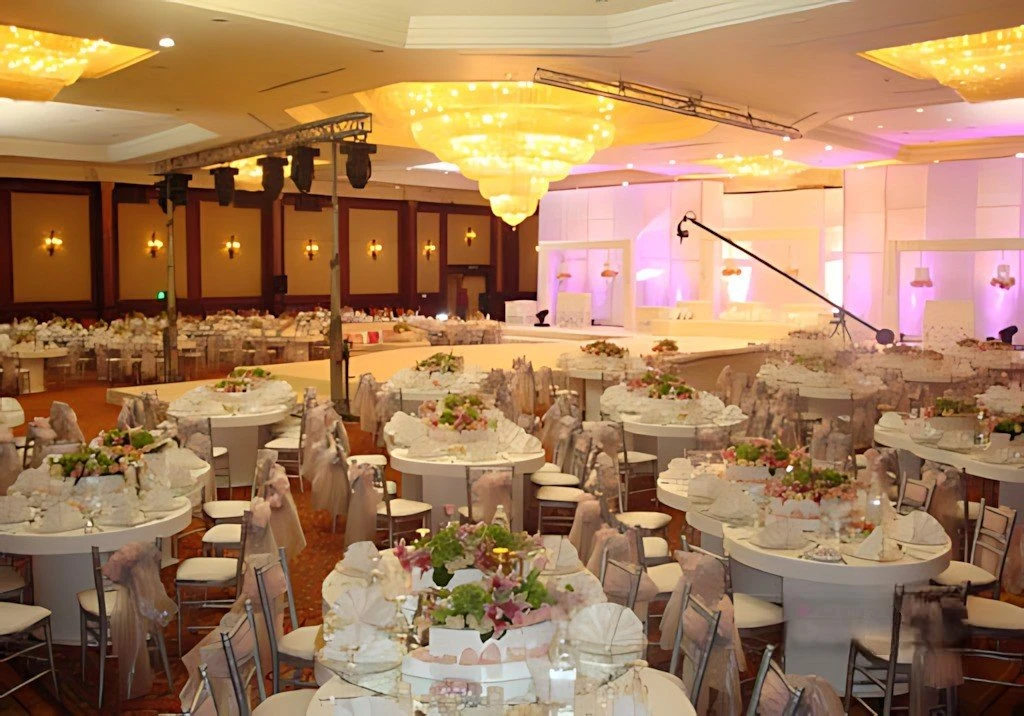 Elegant banquet setup at Regency Hall Doha with chandeliers.