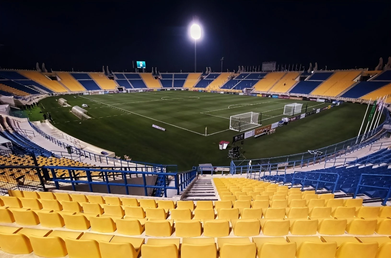 Thani Bin Jassim Stadium in Al Rayyan, empty at night.
