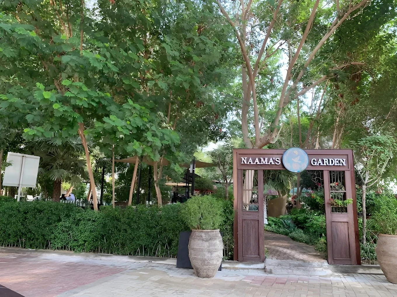 Entrance to Naama’s Garden, lush greenery, Doha venue.