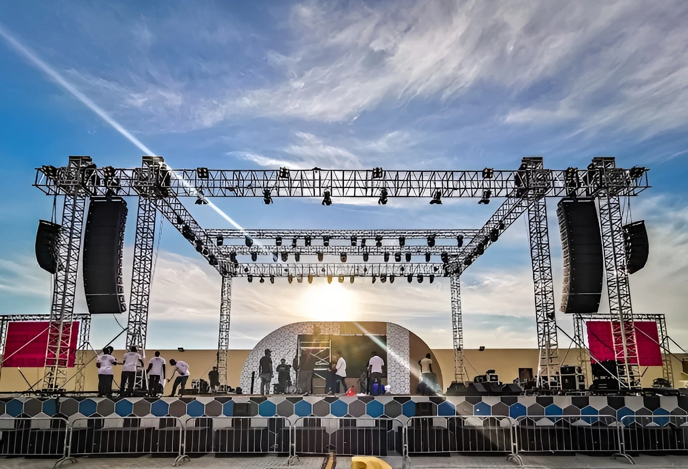 Stage setup at Asian Town Amphitheater, Doha, under a clear sky.