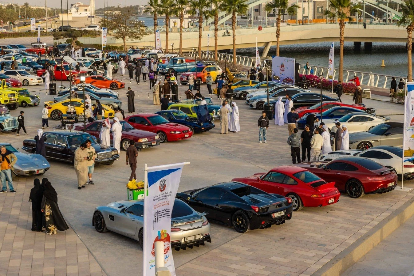 Car show at Al Qana, Abu Dhabi with diverse vehicles displayed.