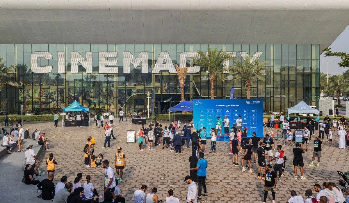 Crowd gathers at Al Qana, Abu Dhabi, for outdoor sports event.