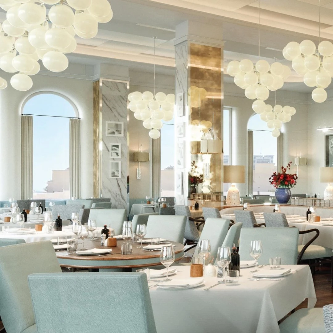 Elegant dining area at Gaia Restaurant Doha with modern chandeliers.