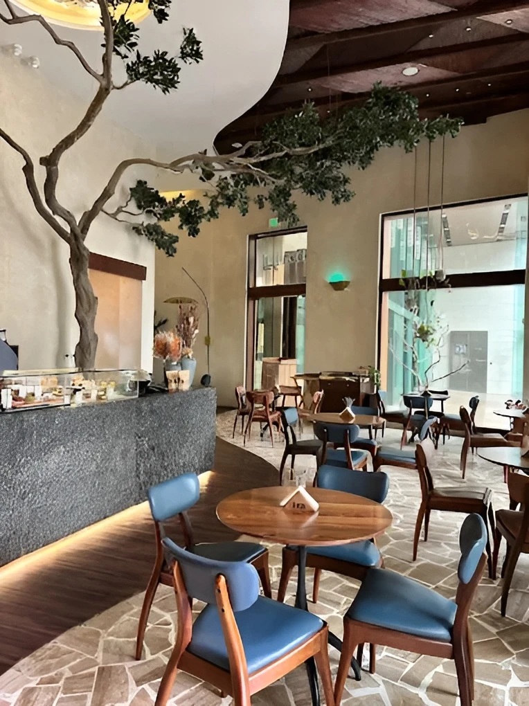 Era Restaurant Doha interior with modern decor and wooden furniture.