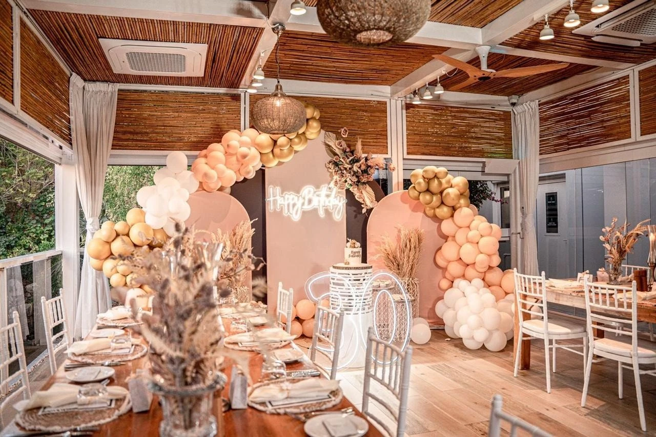 Elegant birthday setup at The Farm Restaurant Al Barari, Dubai.