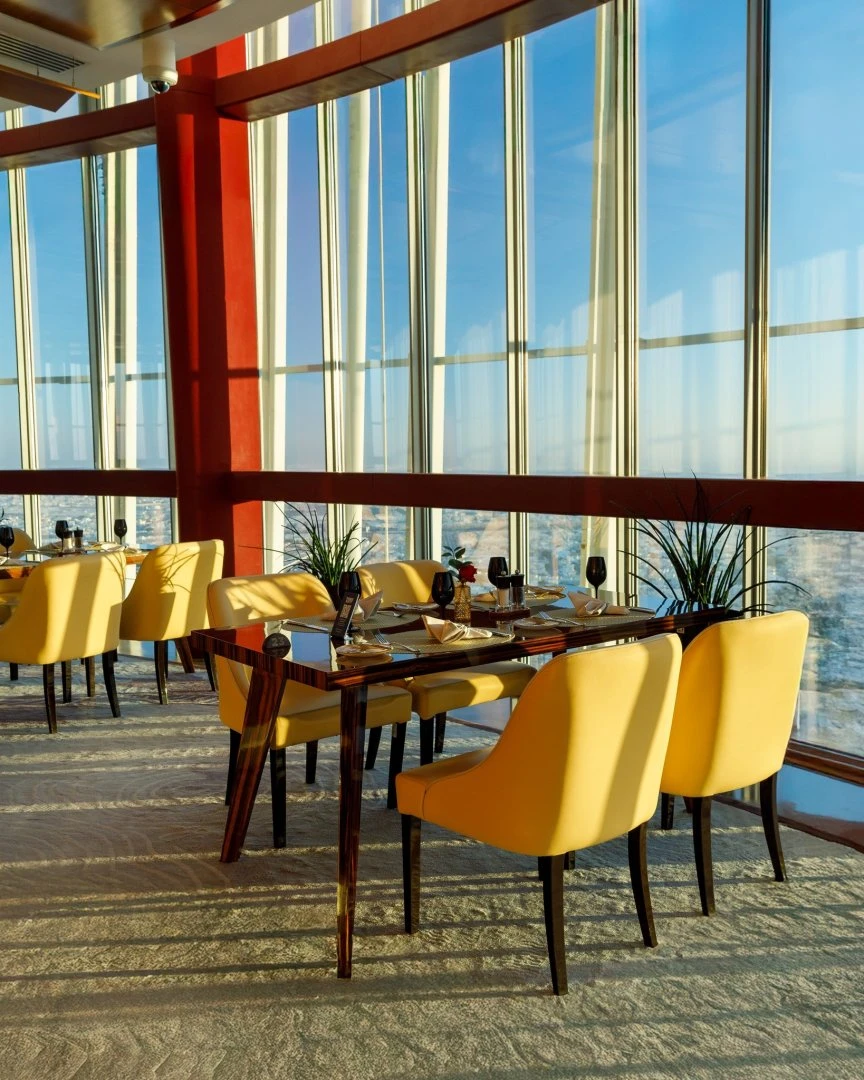 Elegant dining area at Three Sixty Restaurant 360 Doha with city views.