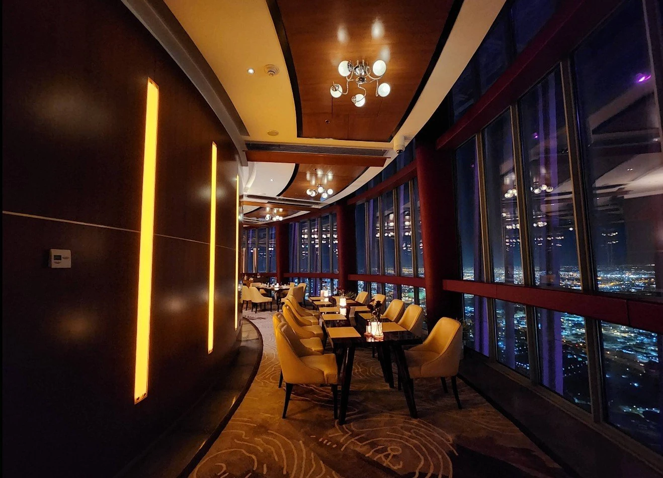 Elegant dining area at Three Sixty Restaurant 360 Doha, city view.