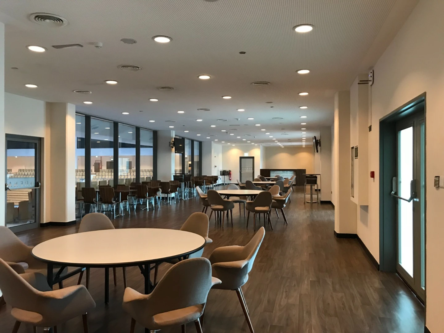Spacious interior of Mubadala Arena in Abu Dhabi with seating area.