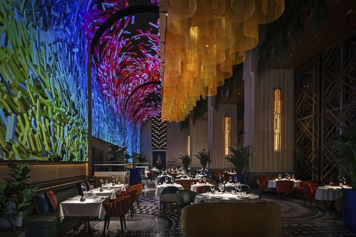 Zenon Restaurant Dubai, vibrant ceiling lights, elegant dining setup.