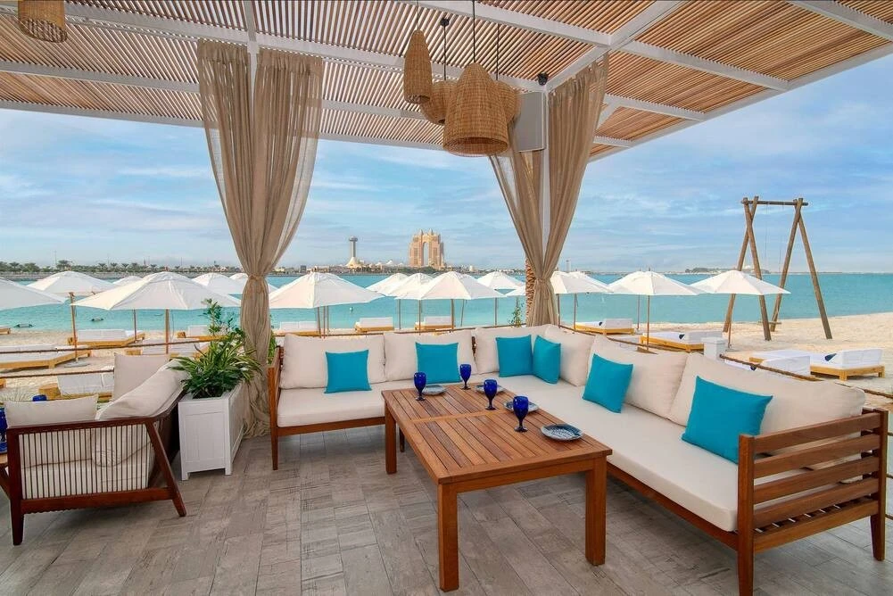 West Bay Lounge Abu Dhabi beachfront seating with ocean view.