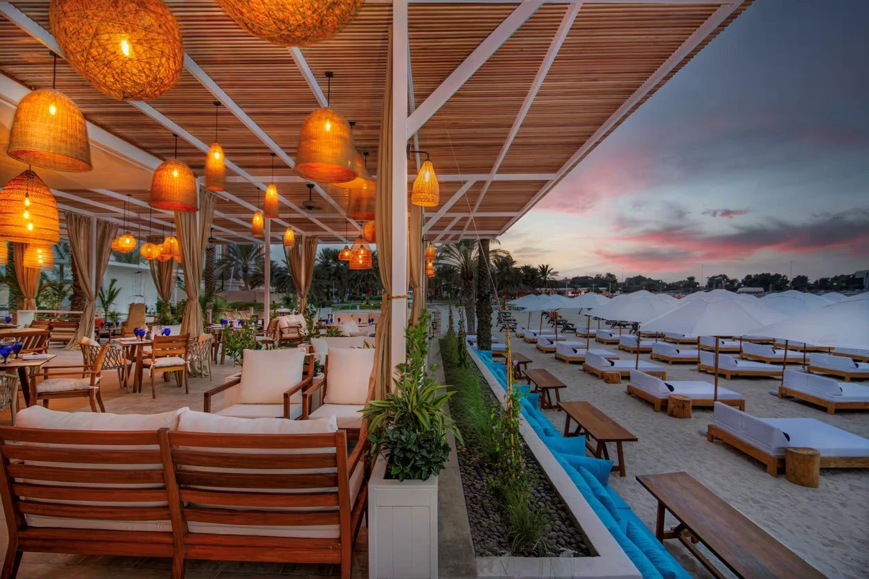 West Bay Lounge Abu Dhabi beachside seating at sunset.