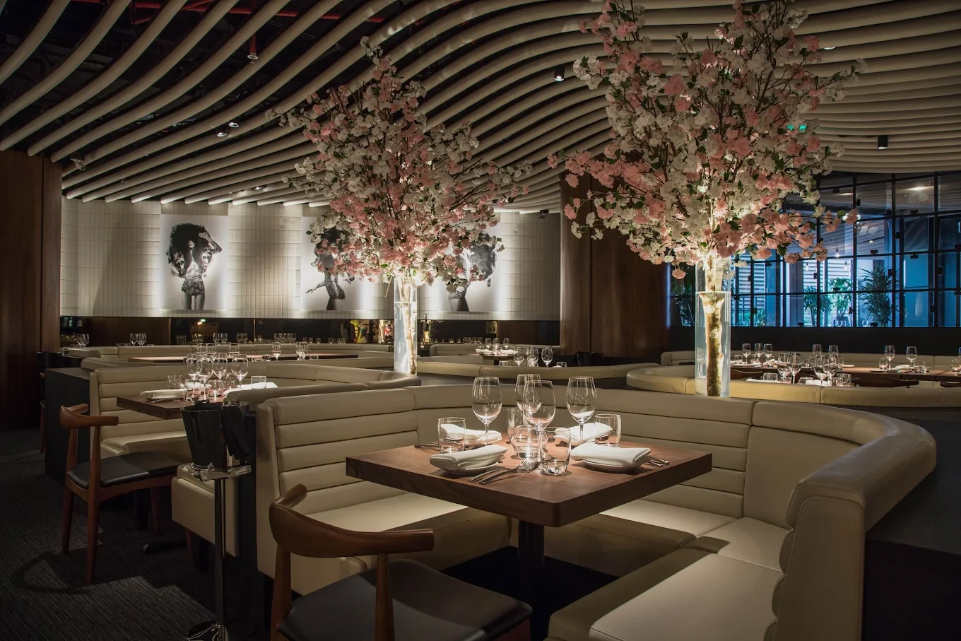 Elegant dining area at STK Dubai JBR with cherry blossom decor.